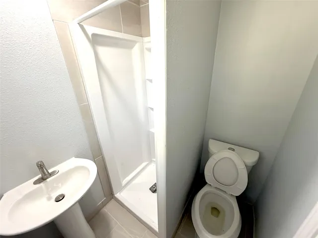 a bathroom with a sink and toilet