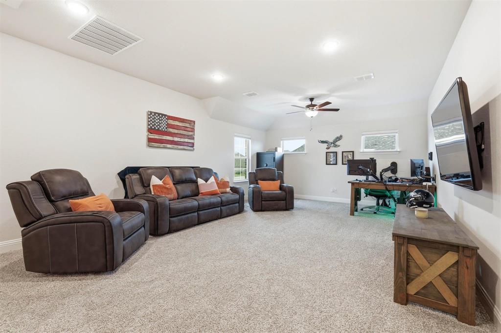 11116 Emory Oak Ridge Flower Mound, TX 76226 - Photo 20 of 40 a living room with furniture and a flat screen tv
