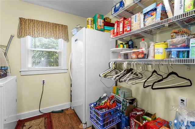 a view of storage and utility room with washer and dryer