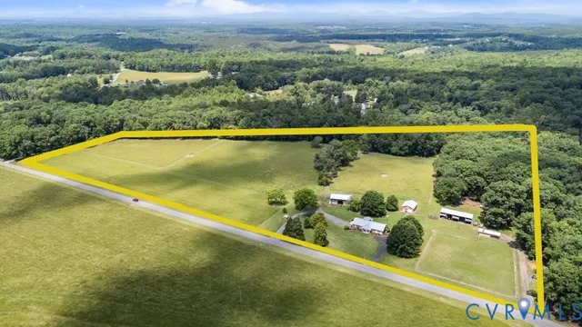 an aerial view of a house with a lake view