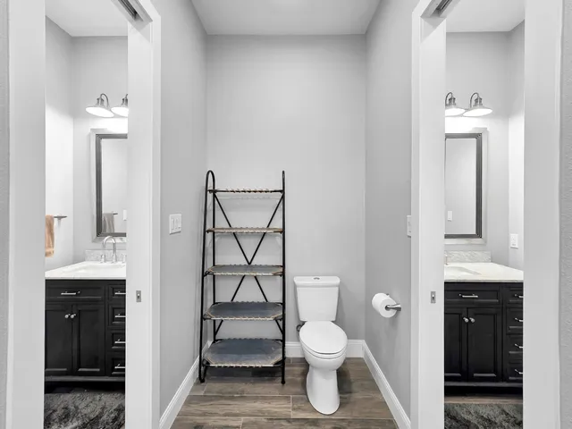 a bathroom with a toilet sink and shower