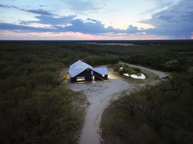 a view of a backyard with sitting space