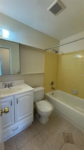 a bathroom with a sink a toilet and bathtub