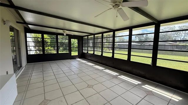 a view of empty room with windows