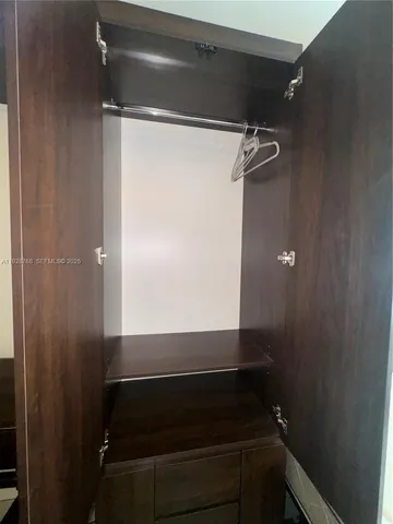 a view of swimming pool with a table and chairs