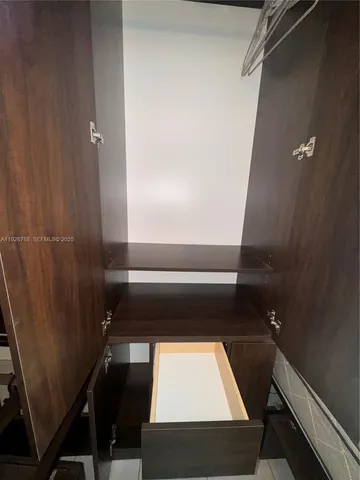 a view of a house with backyard garden and sitting area