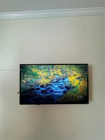 a kitchen with stainless steel appliances granite countertop a refrigerator a sink a stove top oven and granite countertops