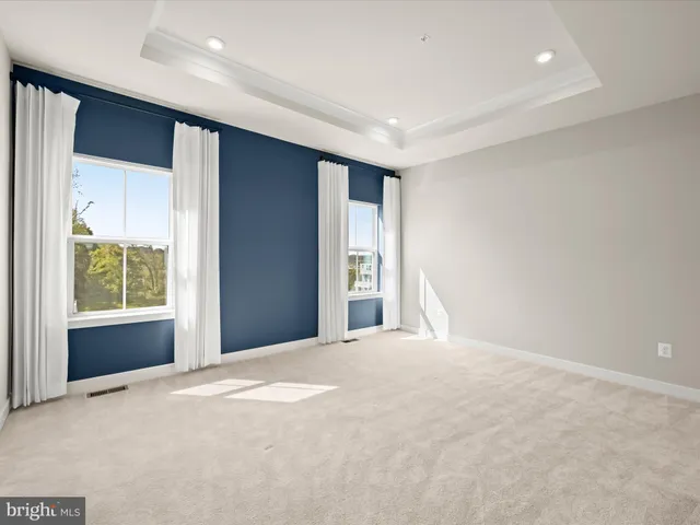 a bathroom with a sink a toilet a mirror a bathtub and shower