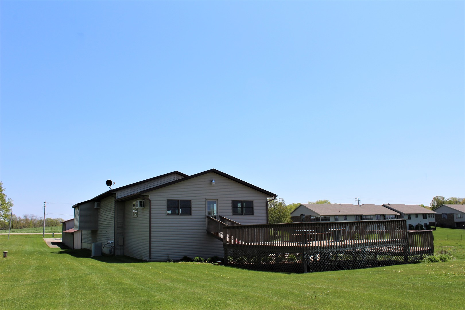 15523 Henry Road Morrison, IL 61270 - Photo 3 of 16 a front view of a house with a garden