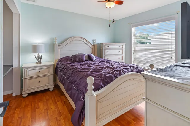 a bedroom with a bed and a dresser