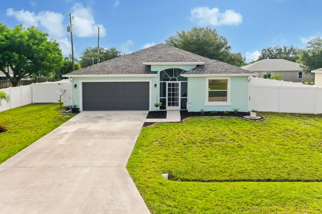a house with trees in the background