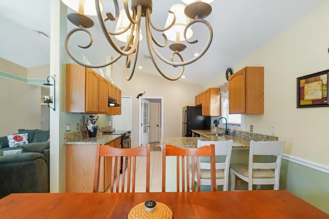 a bedroom with furniture and a mirror