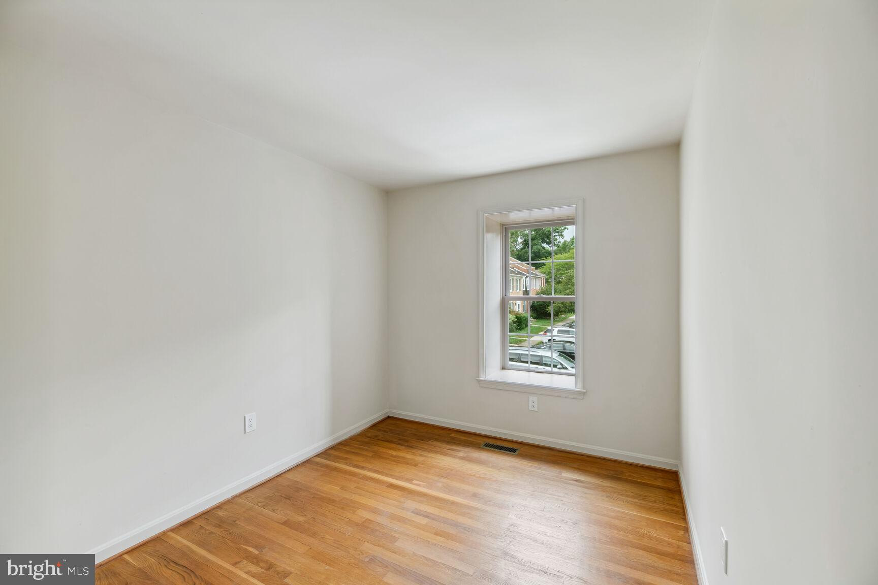 7067 Leestone Street Springfield, VA 22151 - Photo 22 of 39 Bedroom #2 Boasts Hardwood Floors & Fresh Paint!