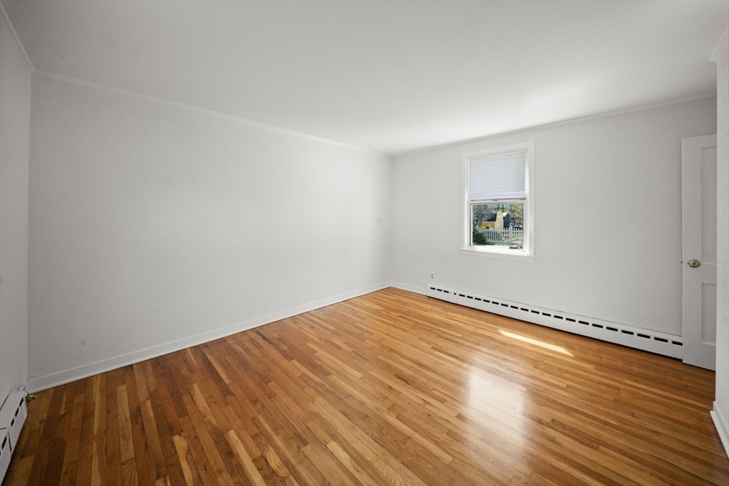 1180 Main Street, Unit 1 Waltham, MA 02451 - Photo 18 of 30 a view of an empty room and a window