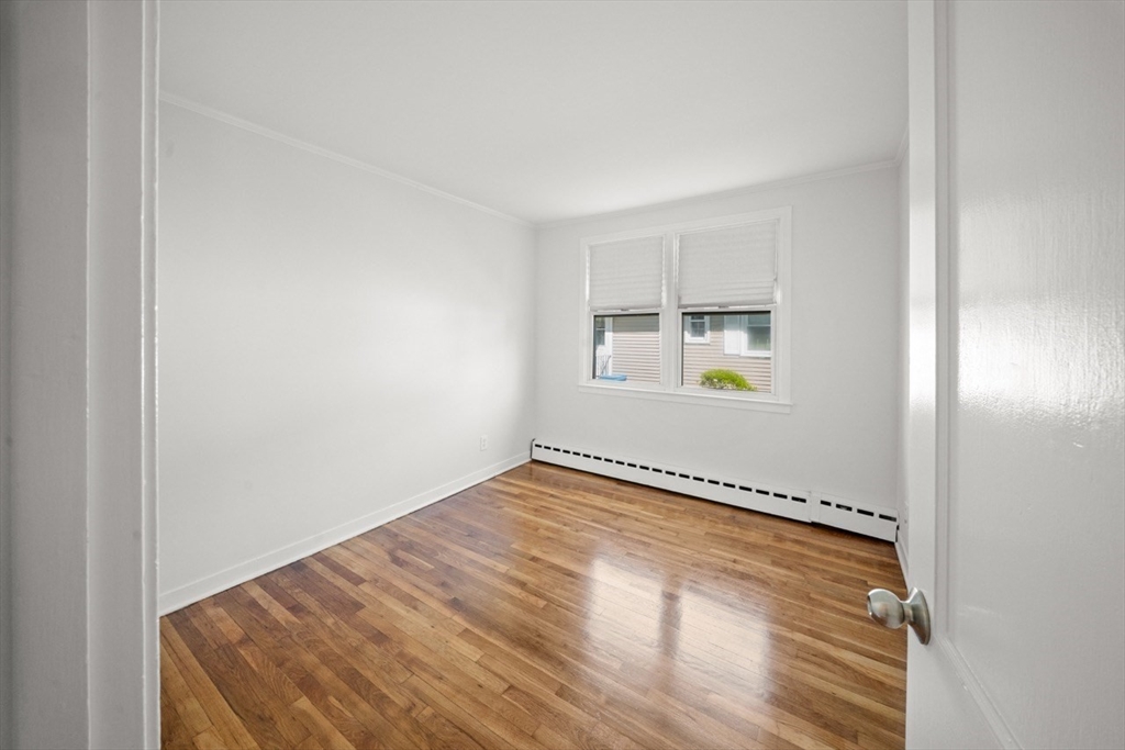 1180 Main Street, Unit 1 Waltham, MA 02451 - Photo 23 of 30 a view of an empty room with a window