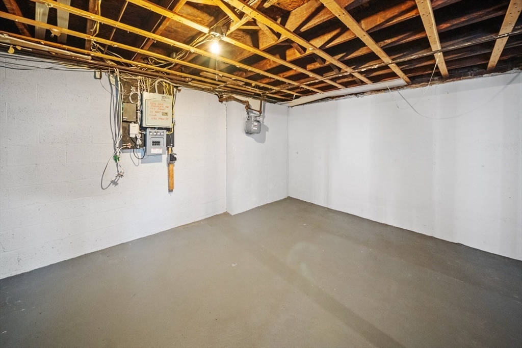 1180 Main Street, Unit 1 Waltham, MA 02451 - Photo 24 of 30 a view of a room with racks on the wall