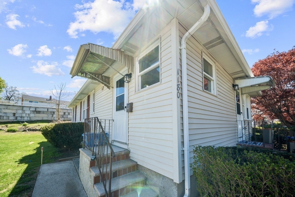 1180 Main Street, Unit 1 Waltham, MA 02451 - Photo 28 of 30 a view of a house with a backyard