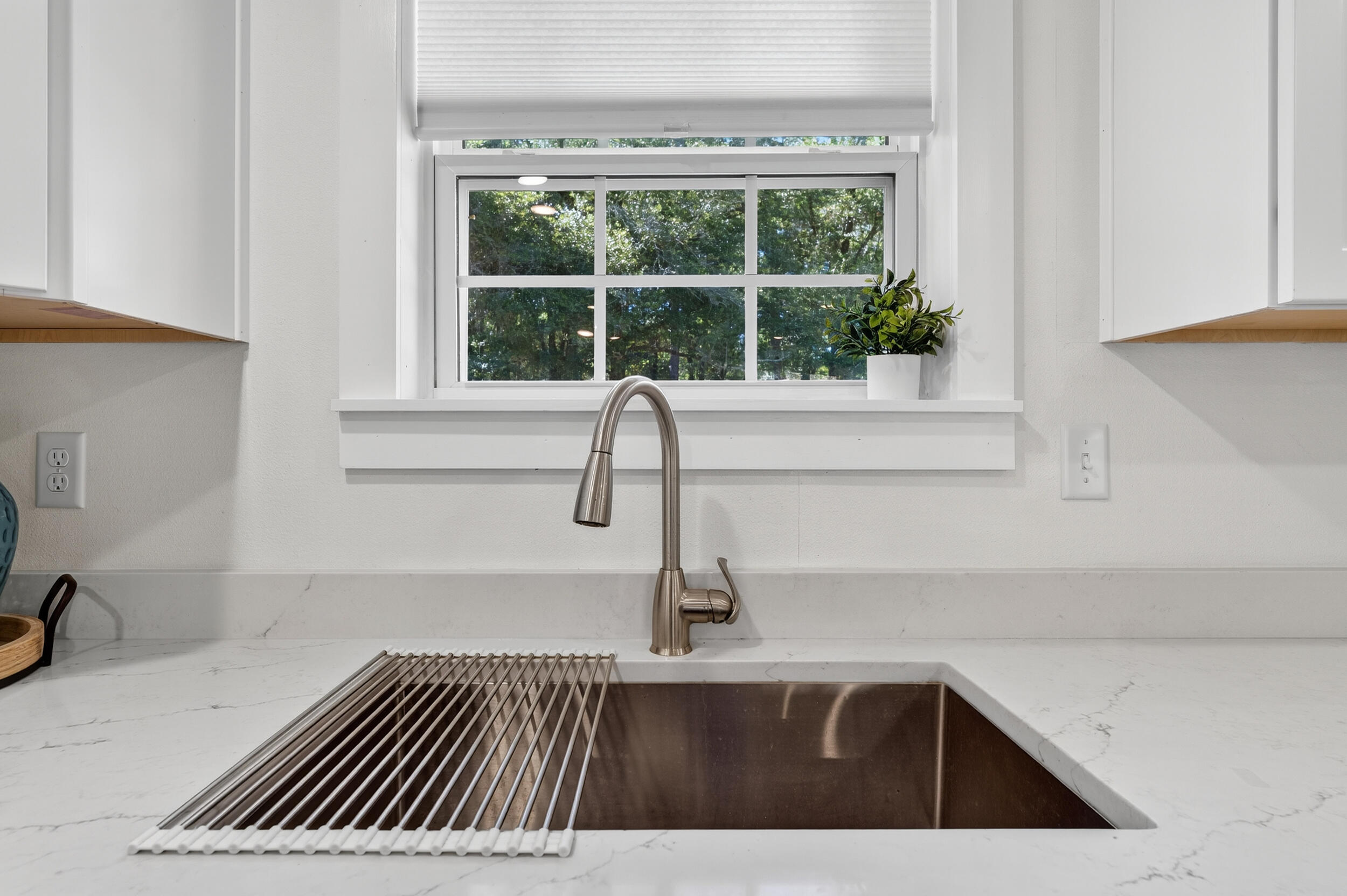4734 Haybarn Road Holt, FL 32564 - Photo 13 of 54 a view of a kitchen sink with dishwasher and cabinets