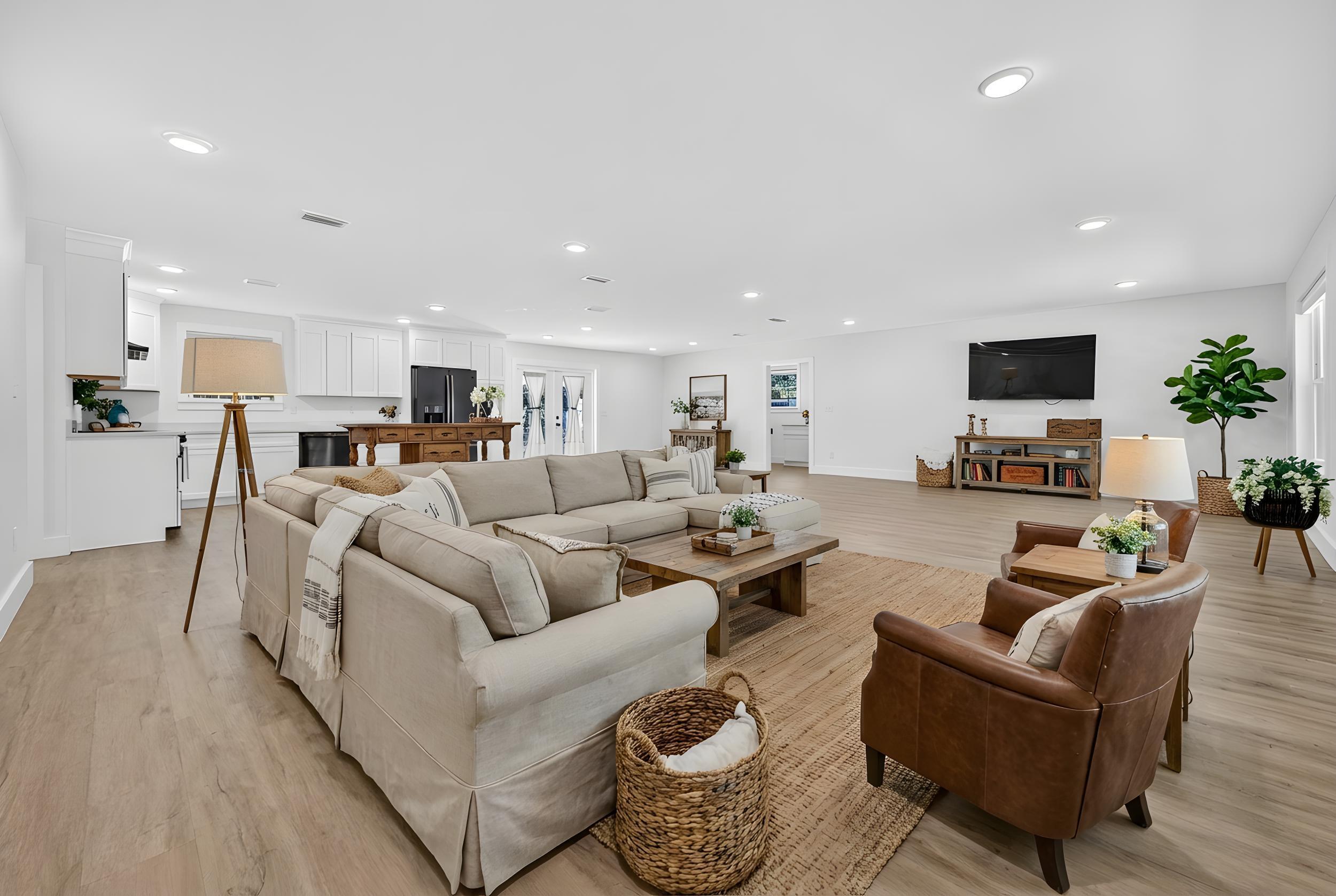 4734 Haybarn Road Holt, FL 32564 - Photo 17 of 56 a living room with furniture and a flat screen tv