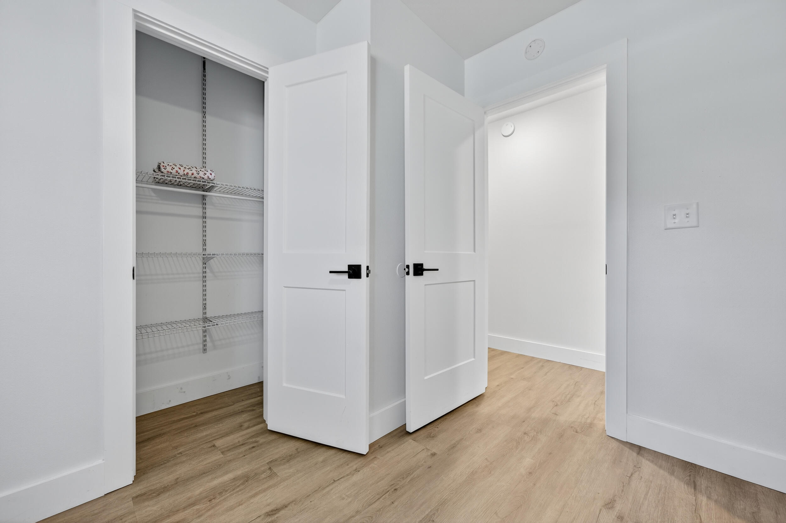 4734 Haybarn Road Holt, FL 32564 - Photo 36 of 56 a view of an empty room with wooden floor and closet