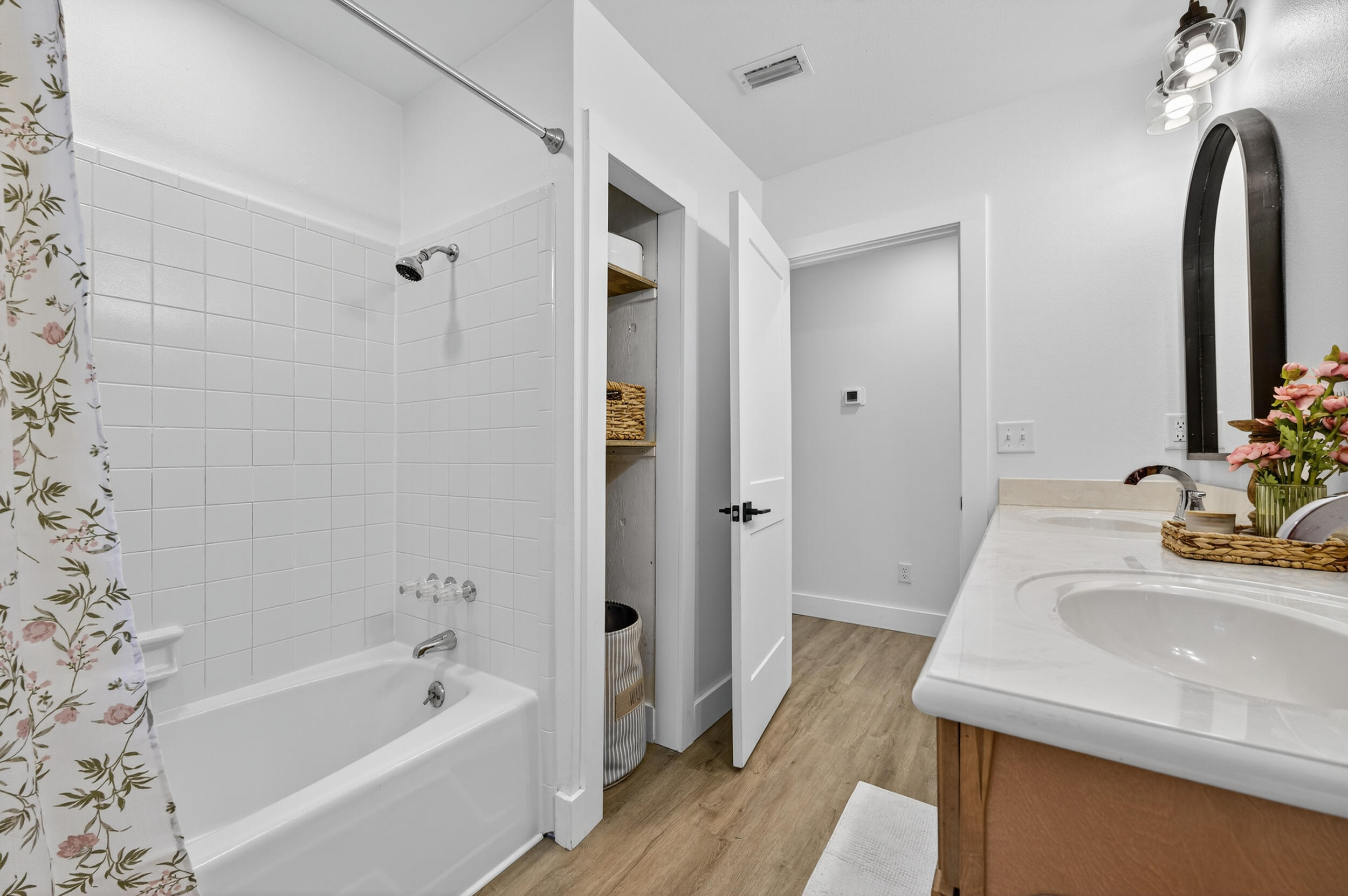 4734 Haybarn Road Holt, FL 32564 - Photo 38 of 56 a bathroom with a sink a bathtub a mirror and shower
