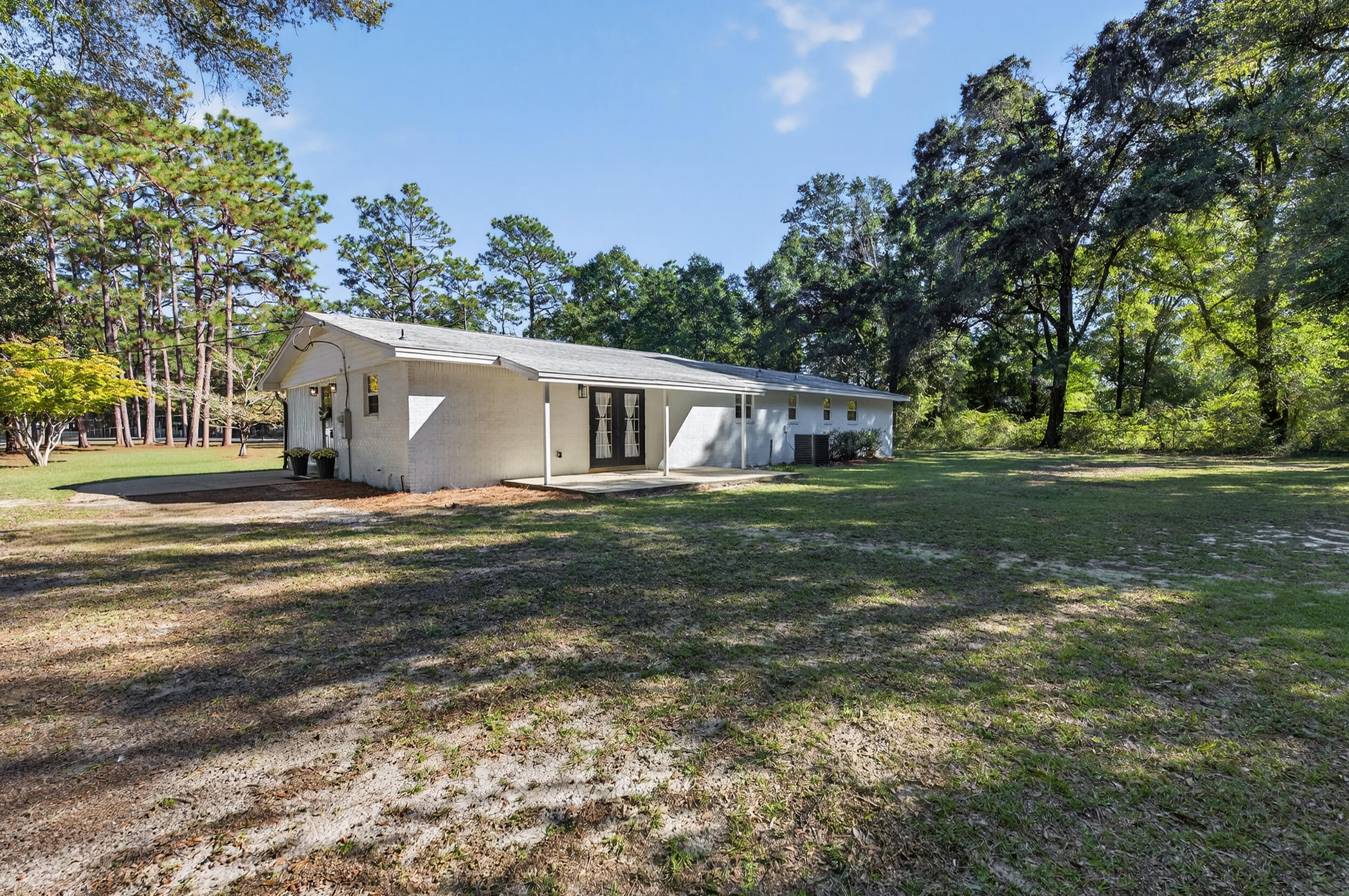 4734 Haybarn Road Holt, FL 32564 - Photo 39 of 56 a view of a house with a yard