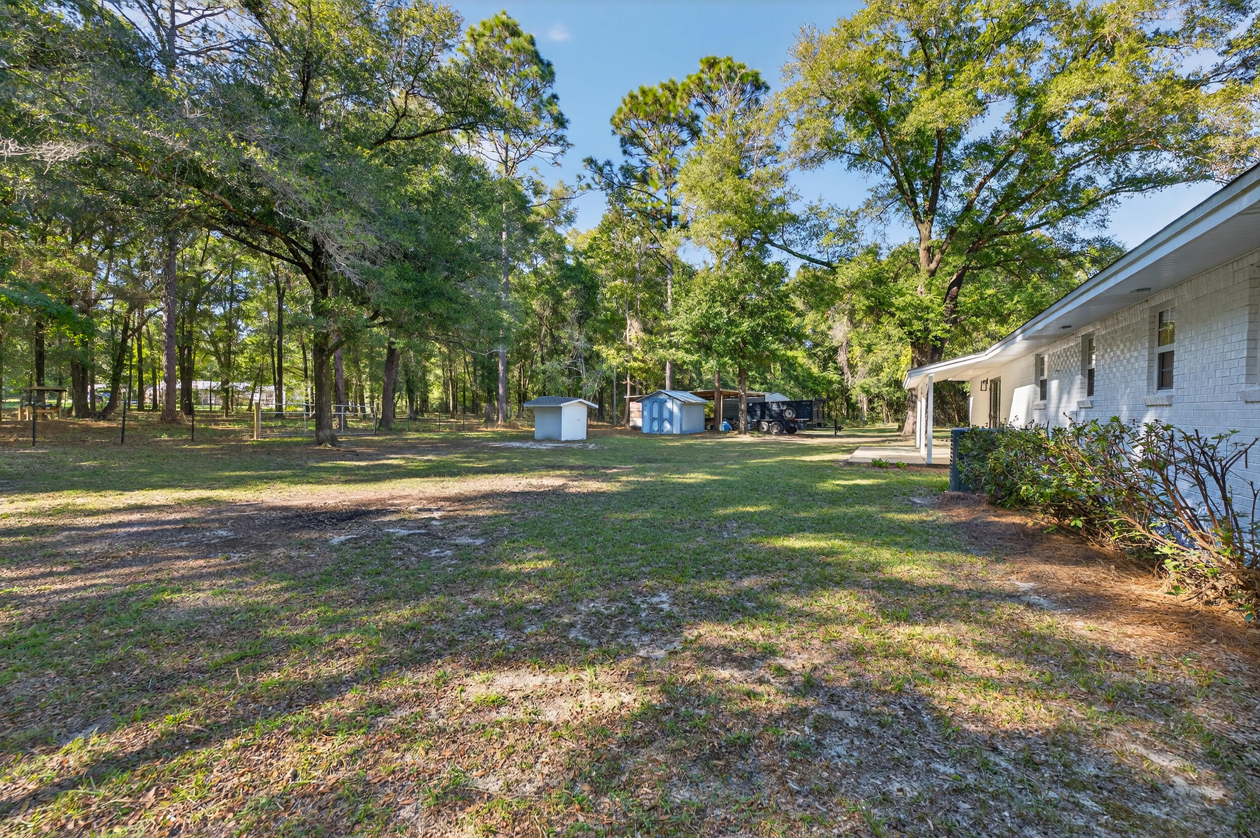 4734 Haybarn Road Holt, FL 32564 - Photo 39 of 54 a view of a house with a big yard