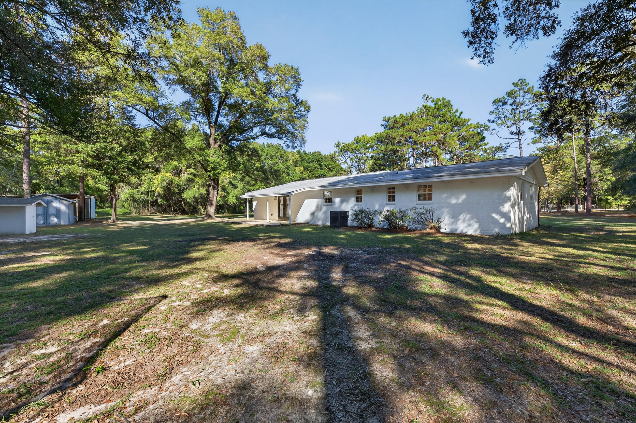 4734 Haybarn Road Holt, FL 32564 - Photo 40 of 56 a front view of a house with a yard