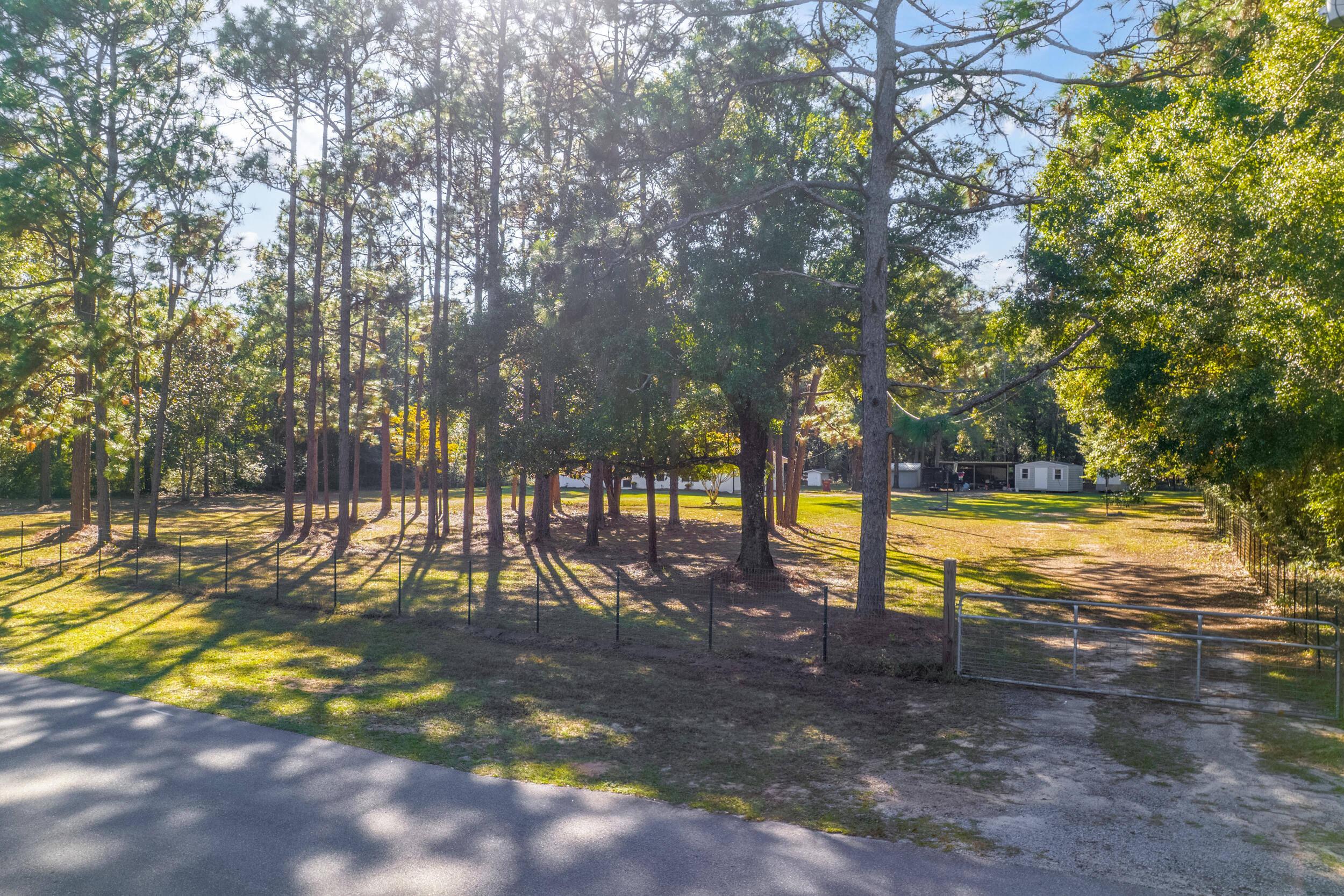4734 Haybarn Road Holt, FL 32564 - Photo 55 of 56 a view of outdoor space with garden