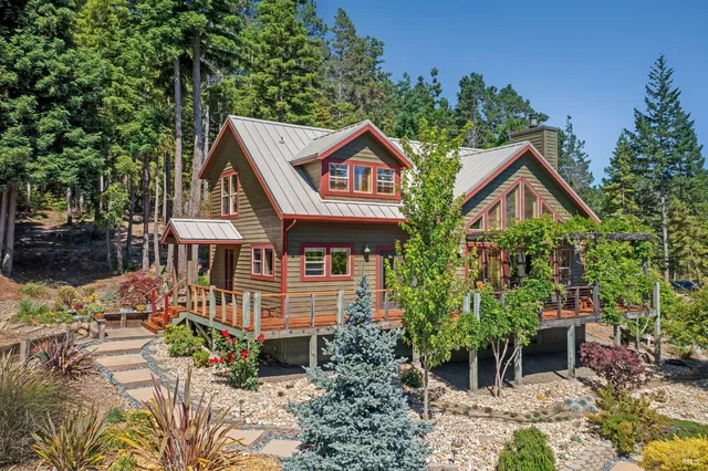 a dining room filled with furniture and chandelier