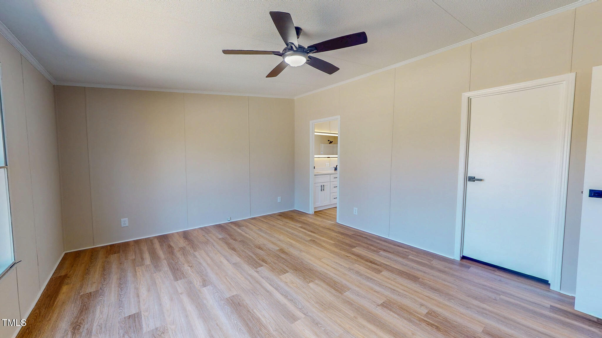 210 Holloway Road Roxboro, NC 27573 - Photo 18 of 44 an empty room with wooden floor and a ceiling fan