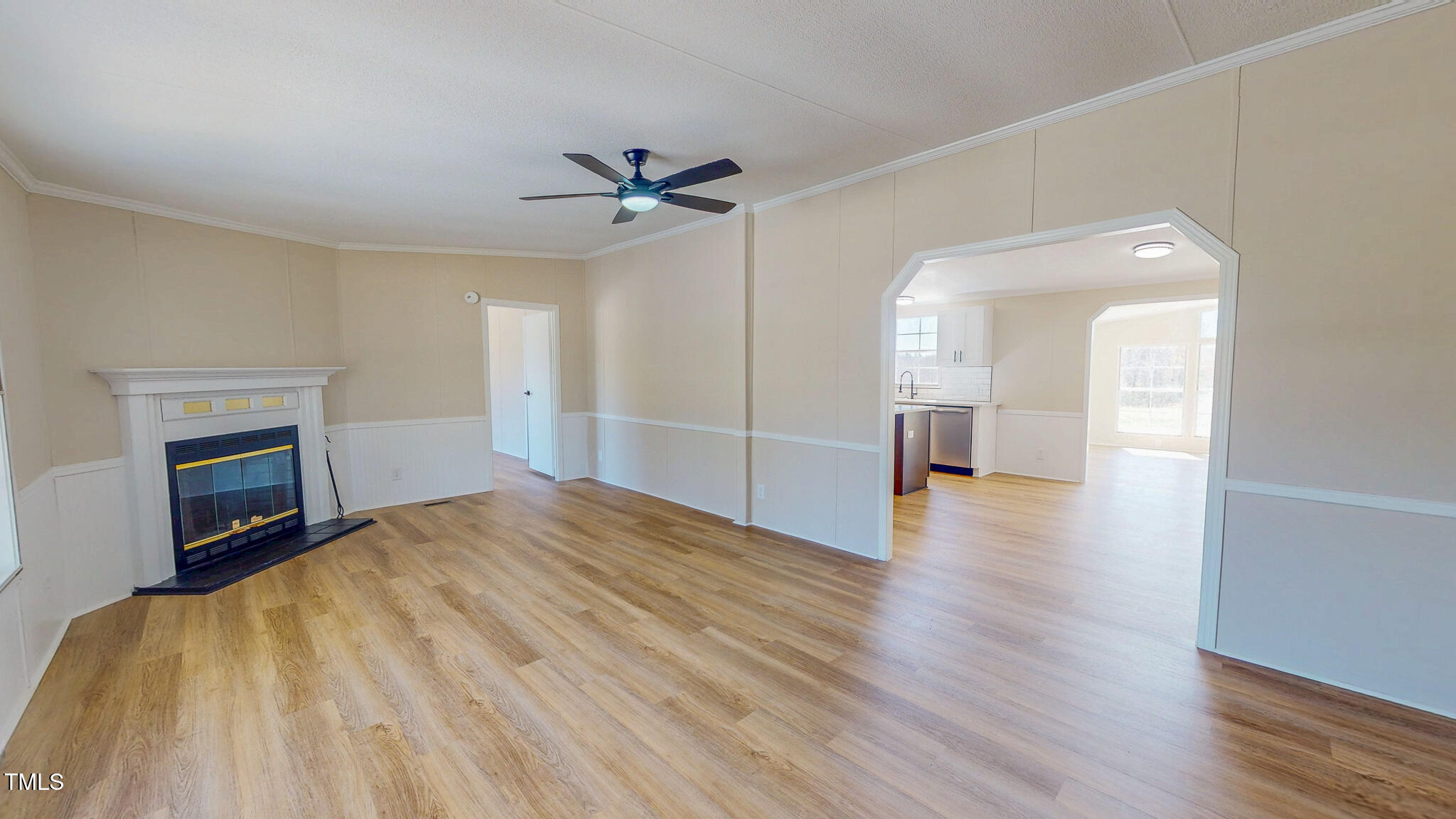 210 Holloway Road Roxboro, NC 27573 - Photo 2 of 44 a view of empty room with wooden floor and fireplace