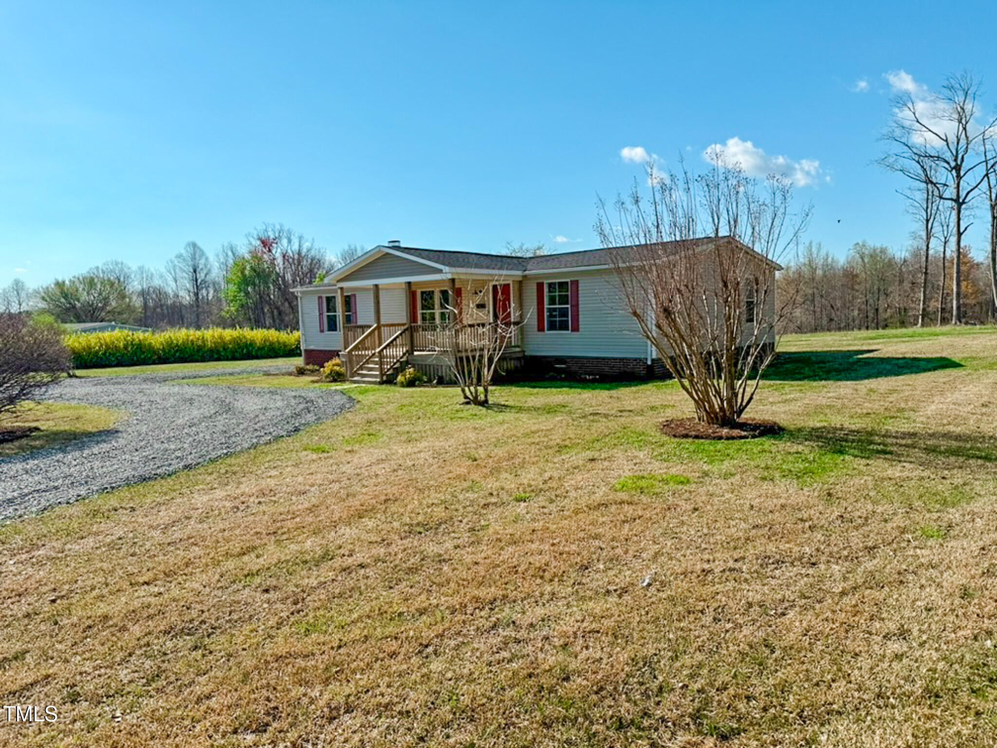 210 Holloway Road Roxboro, NC 27573 - Photo 22 of 44 a view of a house with backyard and a tree