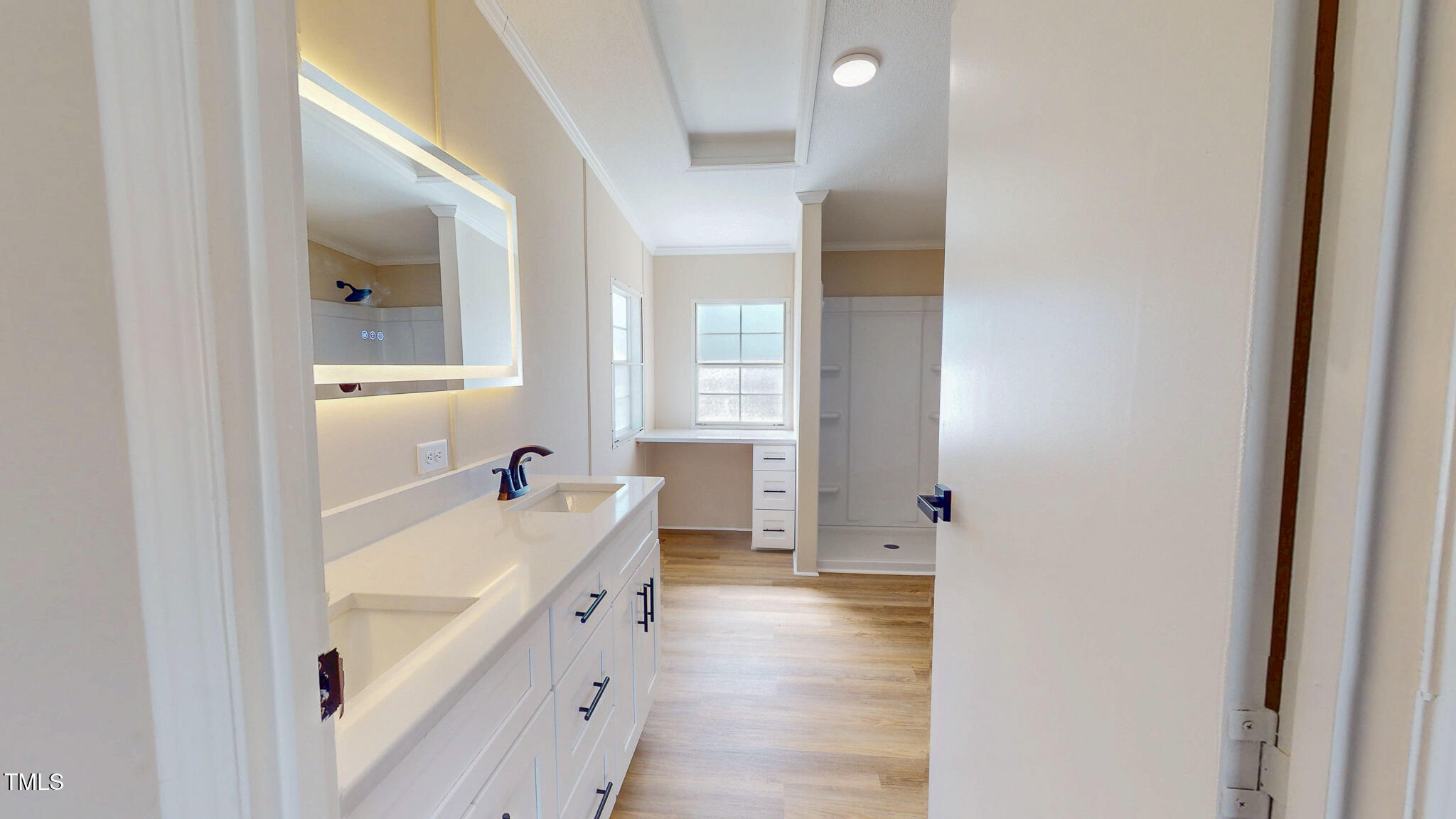 210 Holloway Road Roxboro, NC 27573 - Photo 23 of 44 a bathroom with a sink a mirror and a bathtub