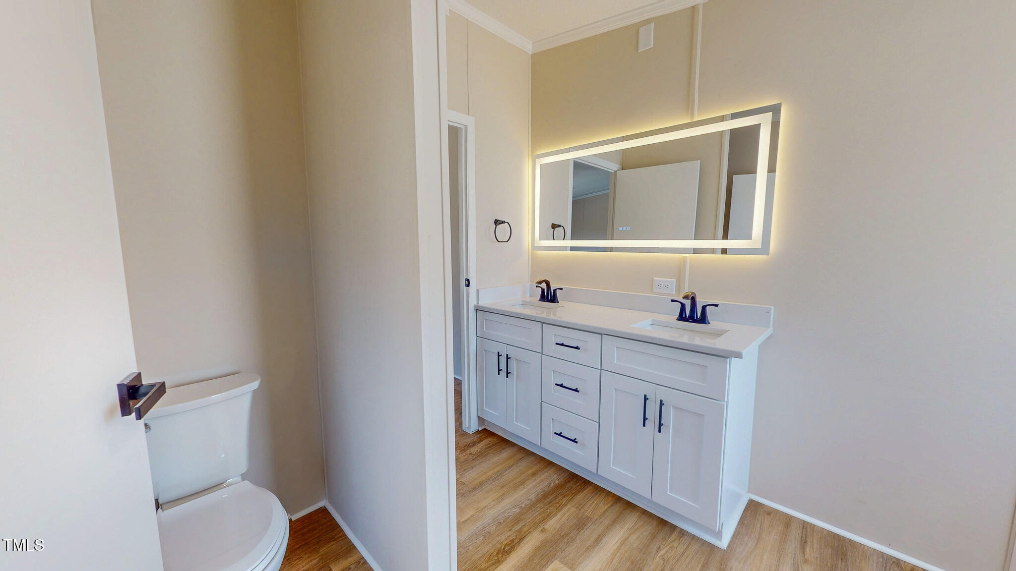210 Holloway Road Roxboro, NC 27573 - Photo 27 of 44 a bathroom with a sink vanity and mirror