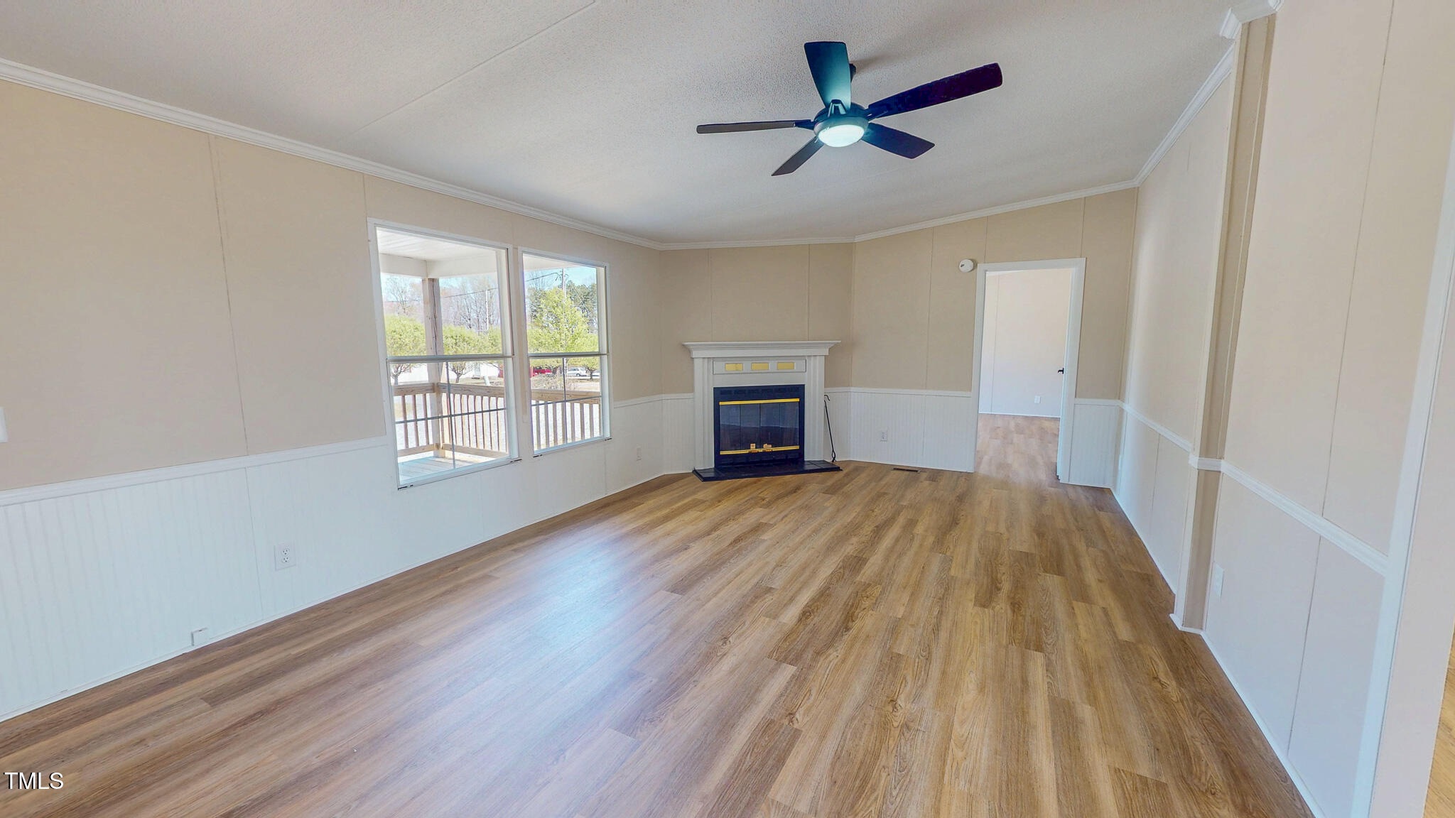 210 Holloway Road Roxboro, NC 27573 - Photo 30 of 44 an empty room with wooden floor and windows