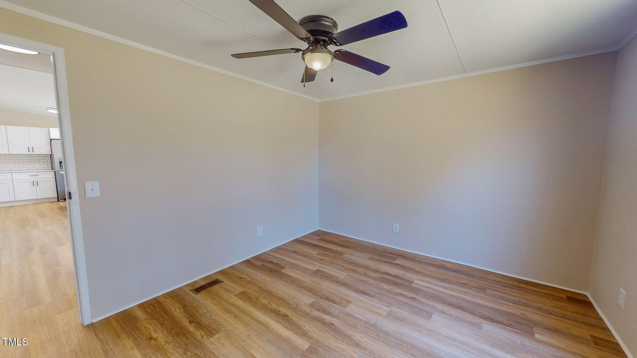 210 Holloway Road Roxboro, NC 27573 - Photo 32 of 44 a view of room with a ceiling fan and wooden floor