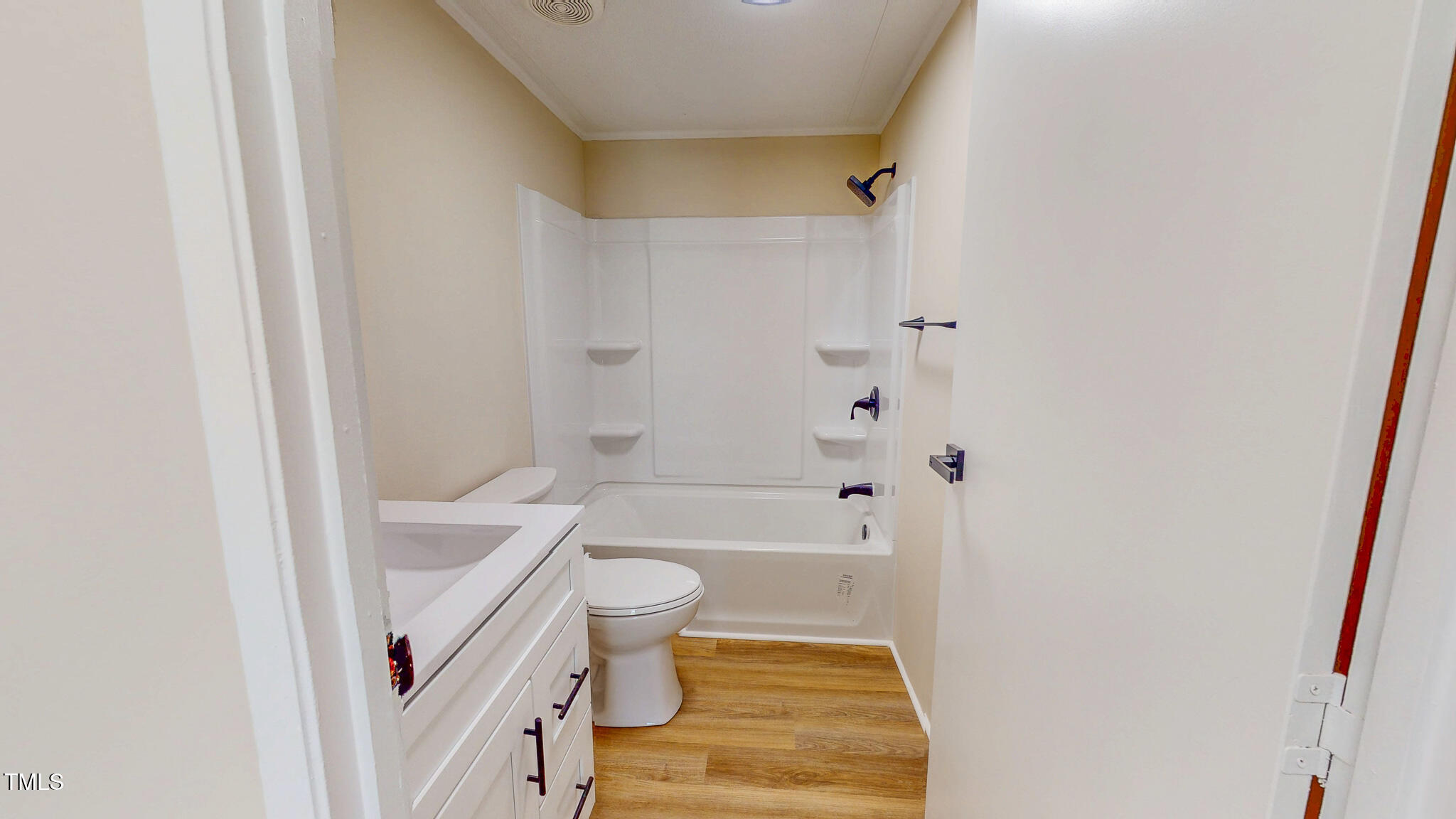 210 Holloway Road Roxboro, NC 27573 - Photo 35 of 44 a bathroom with a sink a toilet a bathtub and shower