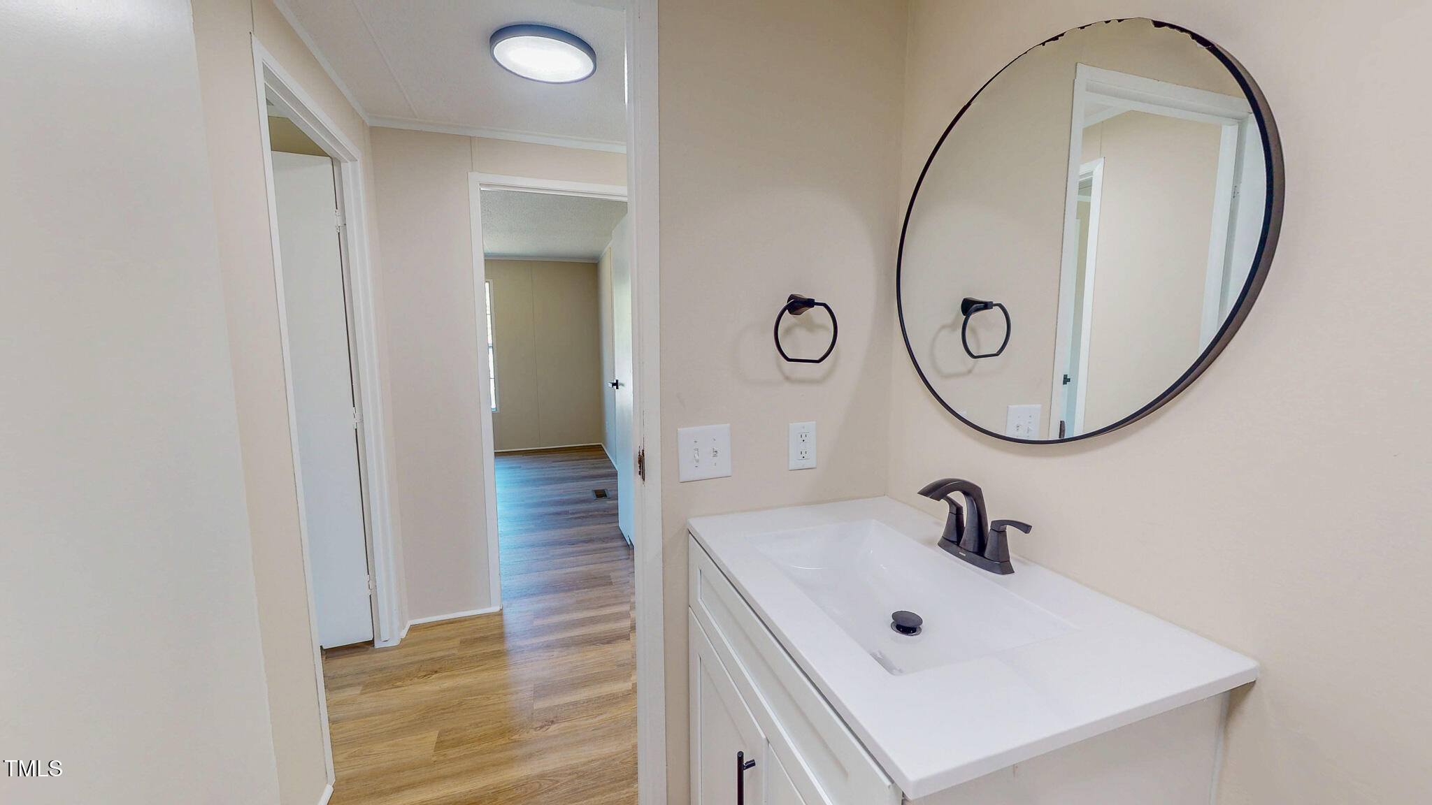 210 Holloway Road Roxboro, NC 27573 - Photo 37 of 44 a bathroom with a sink and mirror