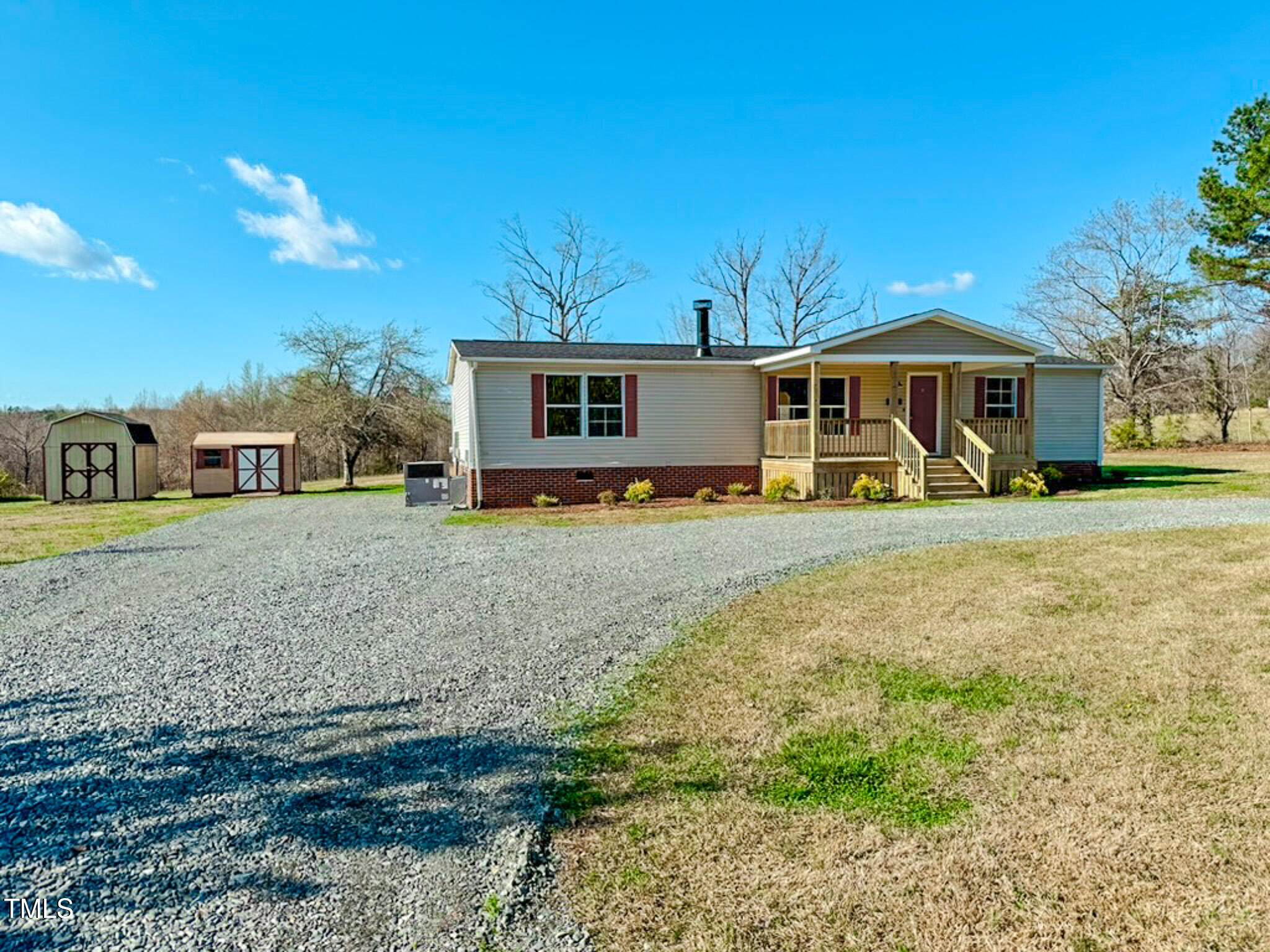 210 Holloway Road Roxboro, NC 27573 - Photo 7 of 44 a front view of a house with garden