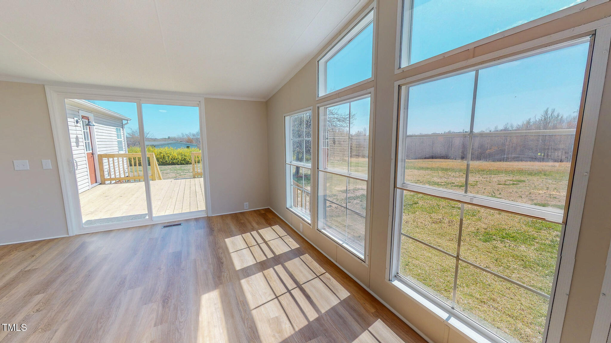 210 Holloway Road Roxboro, NC 27573 - Photo 9 of 44 a view of a room with wooden floor and windows