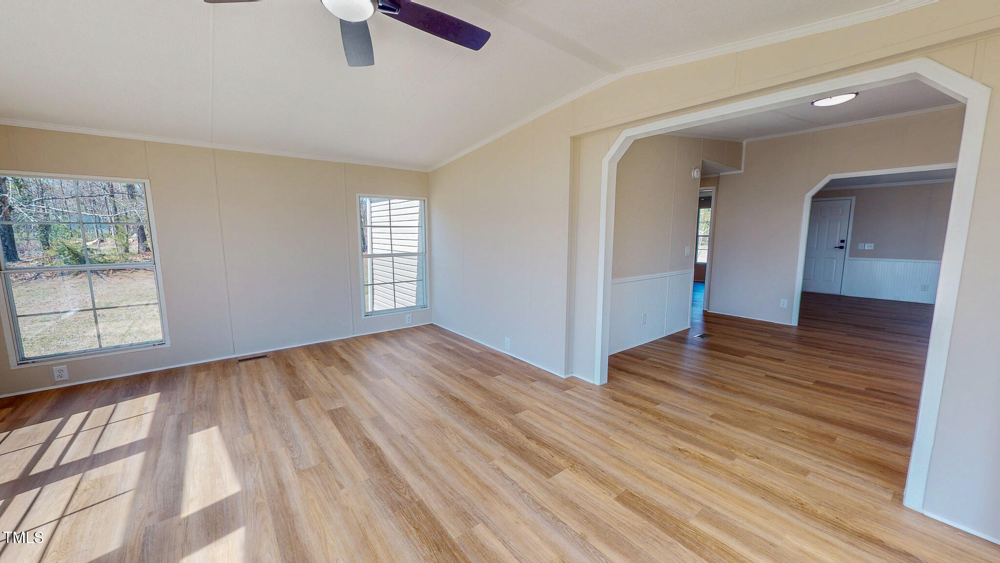 210 Holloway Road Roxboro, NC 27573 - Photo 10 of 44 wooden floor in an empty room with a window