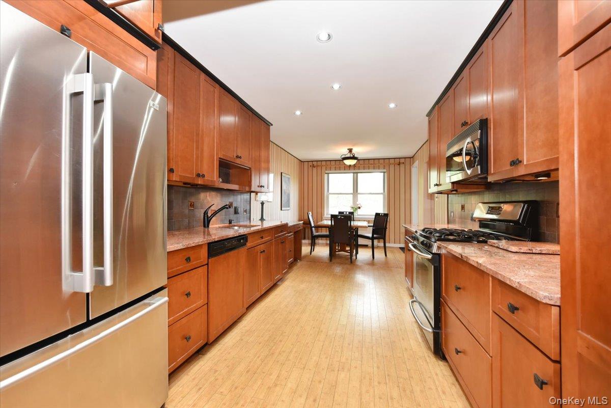 180 South Middle Neck Road, Unit 3K Great Neck, NY 11021 - Photo 4 of 20 Wide Long Kitchen with granite counters + Stainless fridge