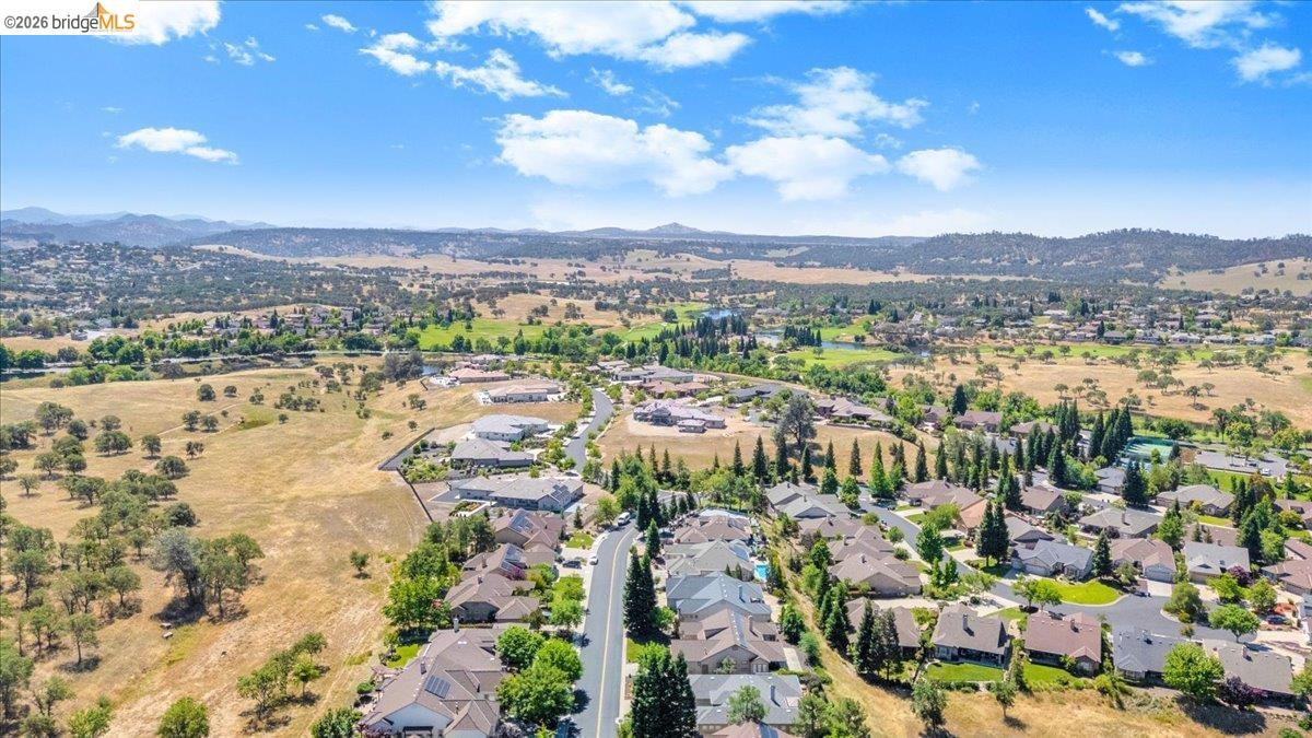 158 Rock Ridge Lane Copperopolis, CA 95228 - Photo 60 of 72 Expansive aerial showcasing a residential community nestled within a verdant landscape