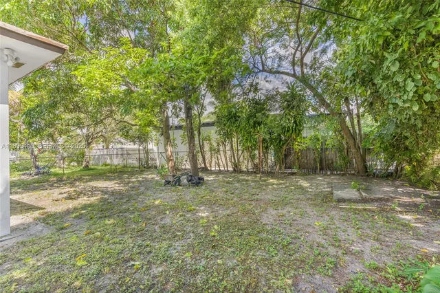 a view of a backyard with a trees