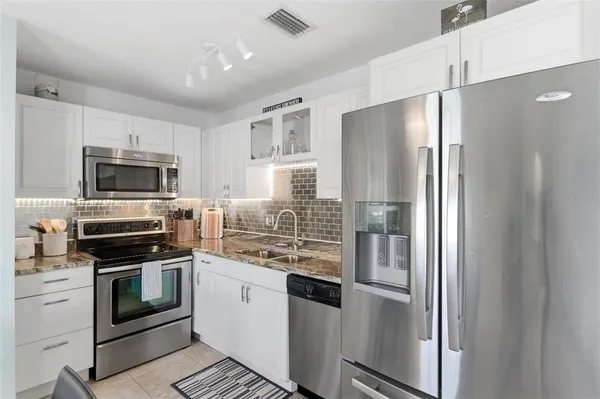 a kitchen with a sink and a window