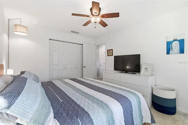 a bedroom with a bed furniture and a window