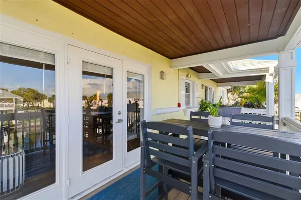 a view of a balcony with chairs