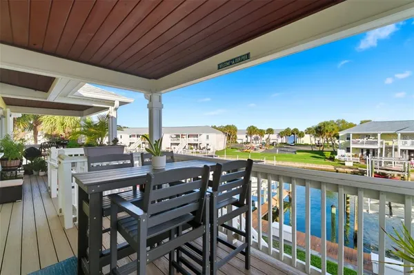 a view of a two chairs in the balcony