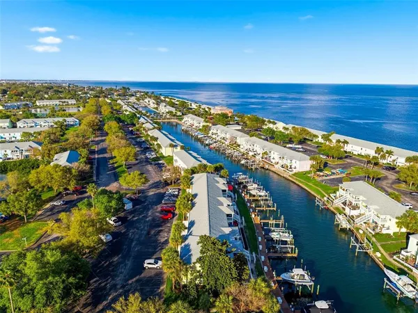 a view of swimming pool with outdoor seating and yard in back